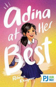 Cover of the PJ Our Way edition of Adina at Her Best, in which Adina is smiling and her school uniform is rumpled and her black ponytail is somewhat askew. 